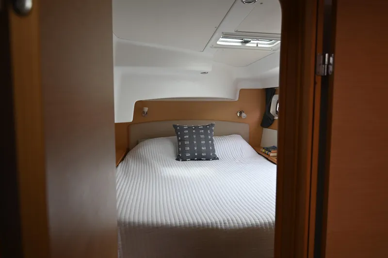 Slide: The Image of Cozy bedroom interior of 2009 Lagoon 440 yacht with a neatly made bed. - 32