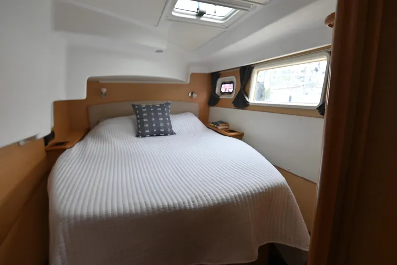 Slide: The Image of Cozy bedroom in 2009 Lagoon 440 yacht with a large bed and window views. - 33