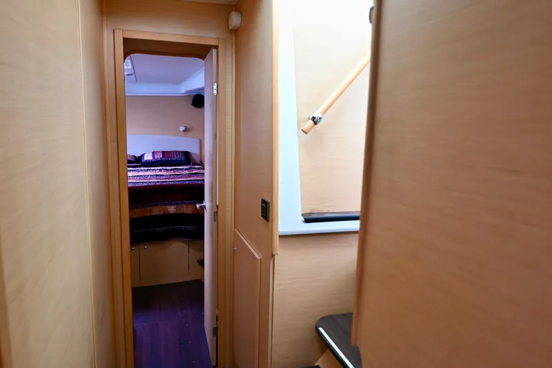 Slide: The Image of Interior hallway of 2009 Lagoon 440 yacht, leading to a cozy cabin. - 38