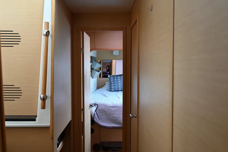 Slide: The Image of Interior hallway of 2009 Lagoon 440 yacht, leading to cozy bedroom. - 40