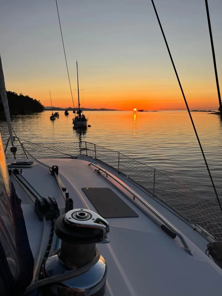Slide: The Image of Lagoon 440 sailboat at sunset on calm waters, 2009 model. - 48