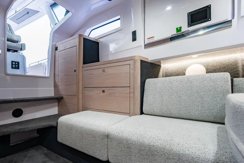 Slide: The Image of Luxurious interior of 2026 Axopar 45 Cross Top boat with modern seating and cabinetry. - 53
