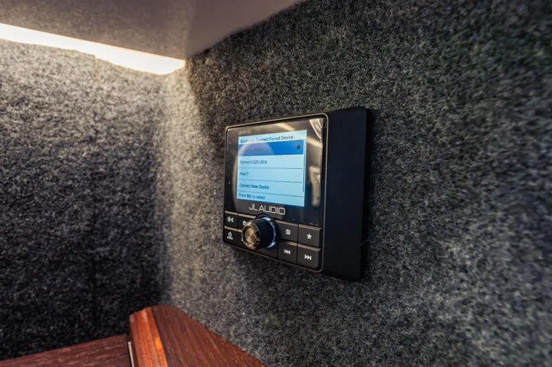 Slide: The Image of JL Audio system in 2026 Axopar 45 Cross Top boat interior. - 55