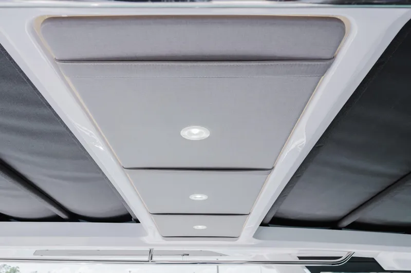 Slide: The Image of Ceiling view of 2026 Axopar 45 Cross Top boat with modern lighting design. - 27