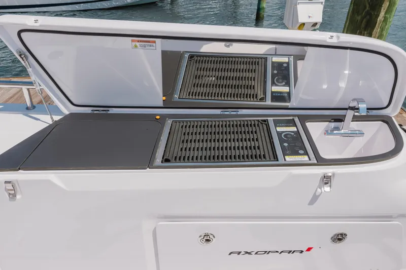 Slide: The Image of Outdoor kitchen on 2026 Axopar 45 Cross Top boat with grill and sink. - 43