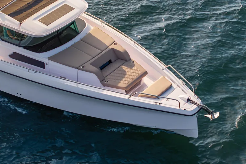 Slide: The Image of 2026 Axopar 45 Cross Top boat with sleek design on open water. - 11