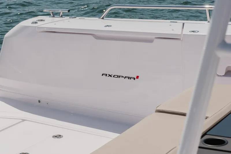 Slide: The Image of 2026 Axopar 45 Cross Top boat, sleek white design on open water. - 49