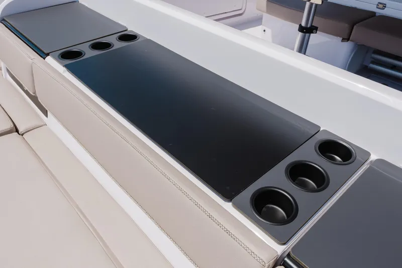 Slide: The Image of Interior of 2026 Axopar 45 Cross Top boat with cup holders and seating area. - 42