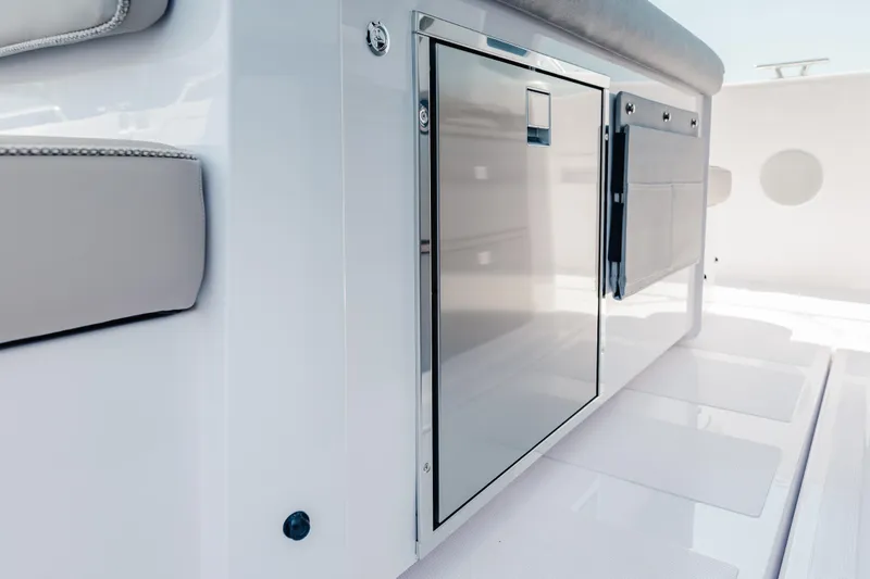 Slide: The Image of 2026 Axopar 45 Cross Top boat interior with sleek storage compartment. - 39