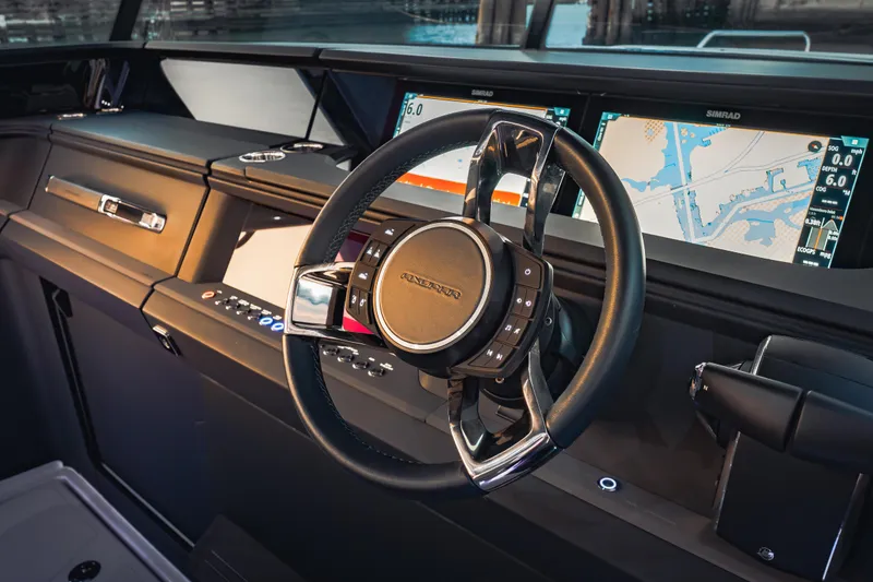 Slide: The Image of Interior dashboard of 2026 Axopar 45 Cross Top with advanced navigation displays. - 34