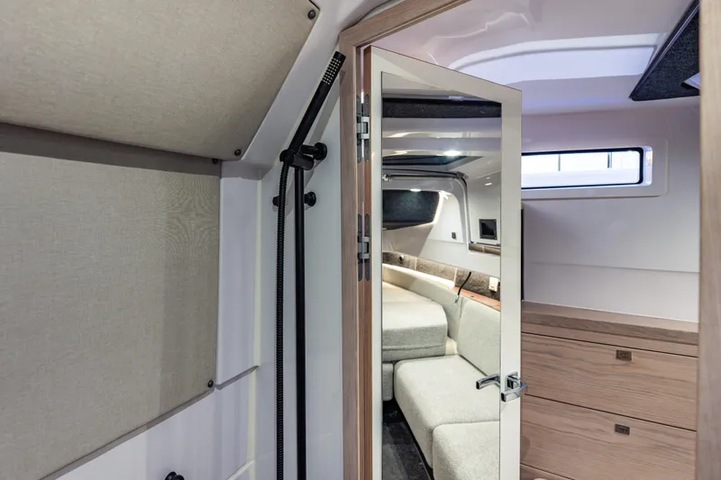 Slide: The Image of Interior cabin of 2026 Axopar 45 Cross Top boat, featuring modern design and comfortable seating. - 61