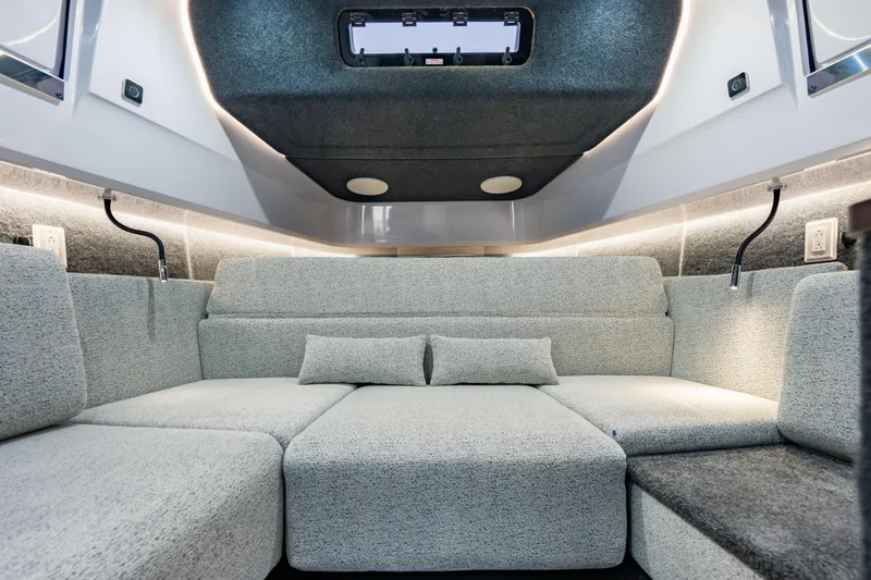Slide: The Image of Luxurious interior of 2026 Axopar 45 Cross Top boat with modern seating and lighting. - 52