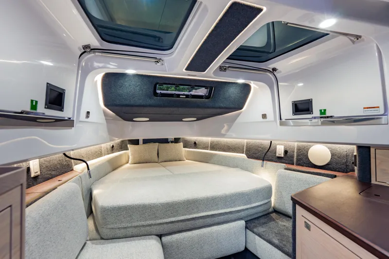 Slide: The Image of Luxurious interior of 2026 Axopar 45 Cross Top boat with modern design and cozy seating. - 51