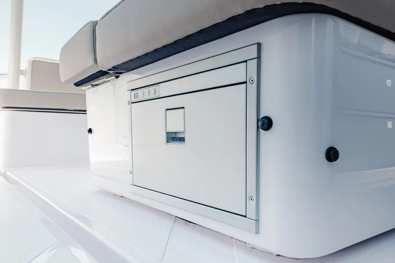 Slide: The Image of 2026 Axopar 45 Cross Top boat interior with sleek seating and storage compartment. - 40