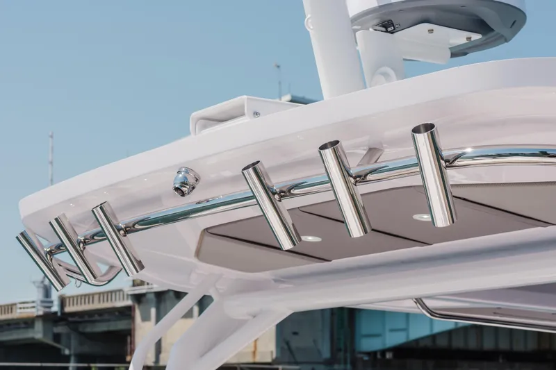 Slide: The Image of 2026 Axopar 45 Cross Top boat with sleek stainless steel rod holders. - 25