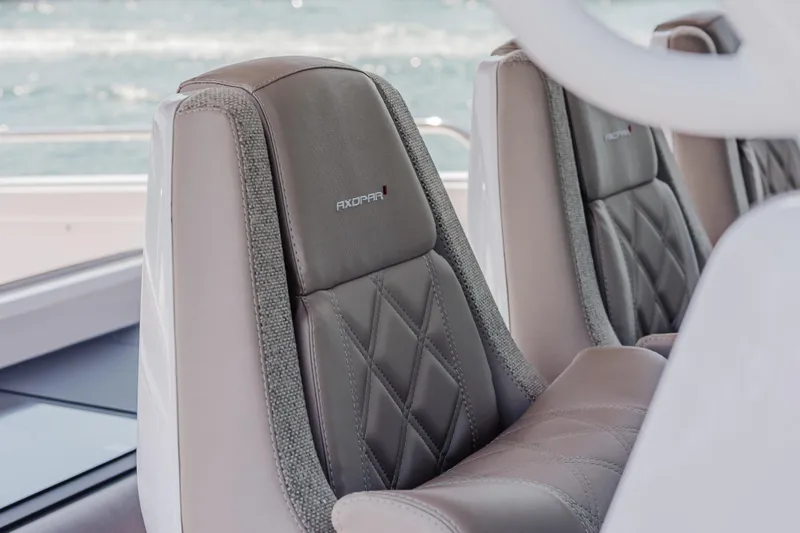 Slide: The Image of Luxurious seating on 2026 Axopar 45 Cross Top boat, featuring elegant stitching and design. - 37