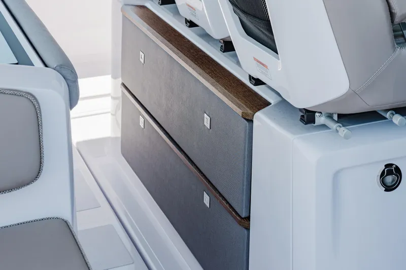 Slide: The Image of Interior seating and storage of 2026 Axopar 45 Cross Top boat, featuring sleek design. - 50