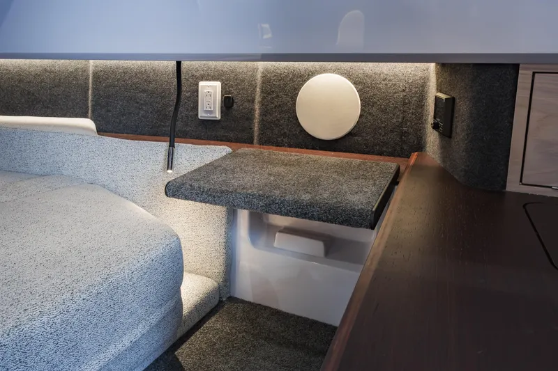 Slide: The Image of Interior of 2026 Axopar 45 Cross Top, featuring modern design and cozy seating area. - 54