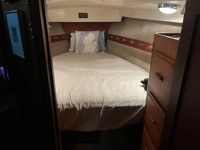 Slide: The Image of Cozy cabin interior of 1984 O'Day 34 Sloop with bed and storage. - 14
