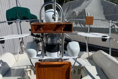 Slide: The Image of 1984 O'Day 34 Sloop cockpit with steering wheel and navigation equipment. - 21