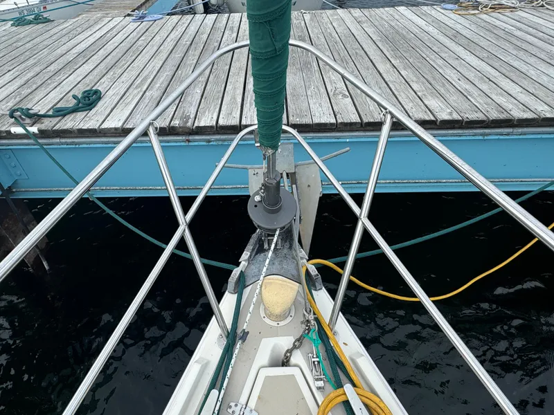 Slide: The Image of Bow view of 1984 O'Day 34 Sloop docked, showing deck and rigging details. - 28