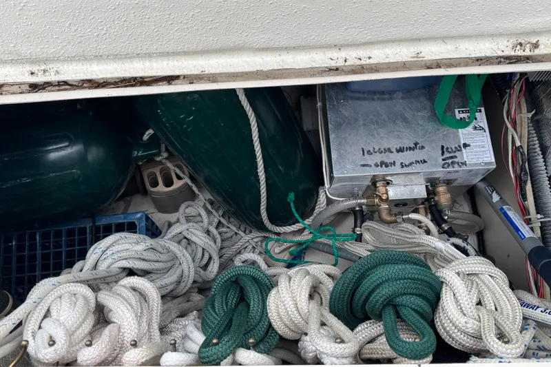 Slide: The Image of Storage compartment of 1984 O'Day 34 Sloop with ropes and equipment. - 33