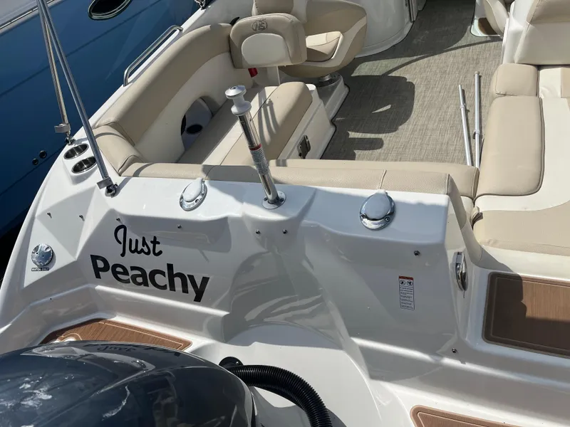 Slide: The Image of 2018 NauticStar 243DC Sport Deck boat with "Just Peachy" name on the stern. - 3