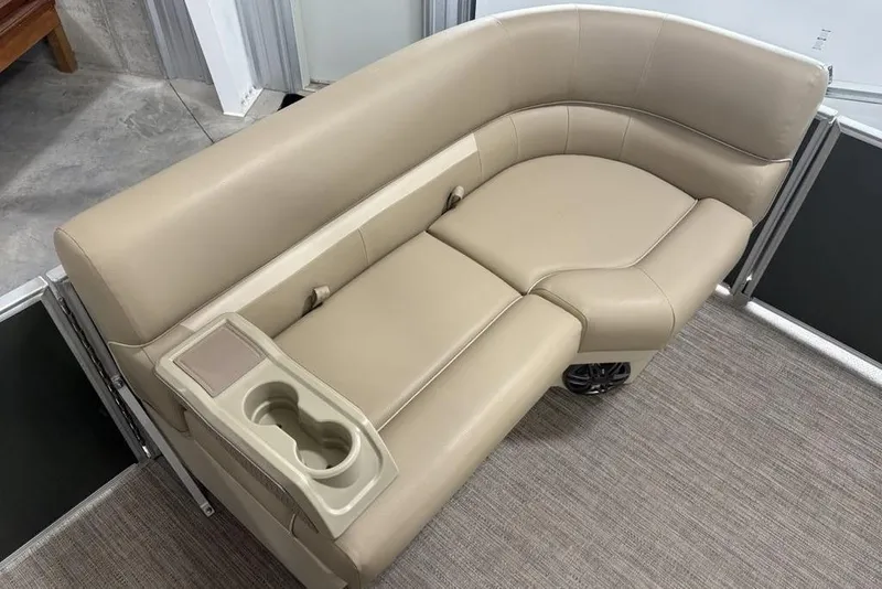 Slide: The Image of 2025 Godfrey Xperience 2086 SBX boat seating with beige upholstery and built-in cup holders. - 12