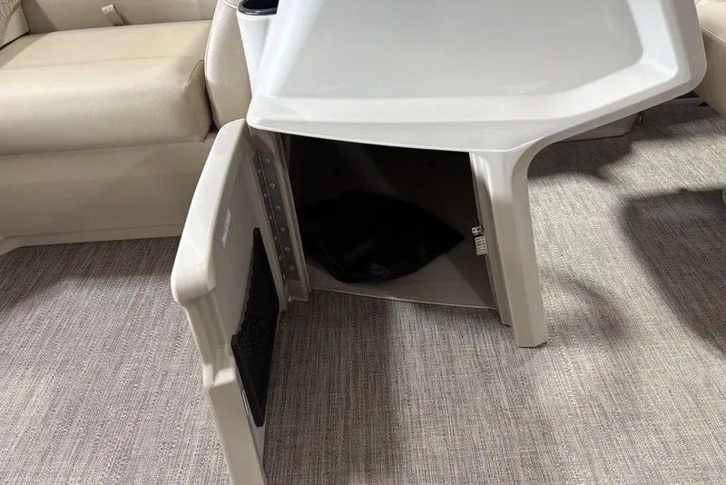 Slide: The Image of Open storage compartment in 2025 Godfrey Xperience 2086 SBX boat interior. - 17