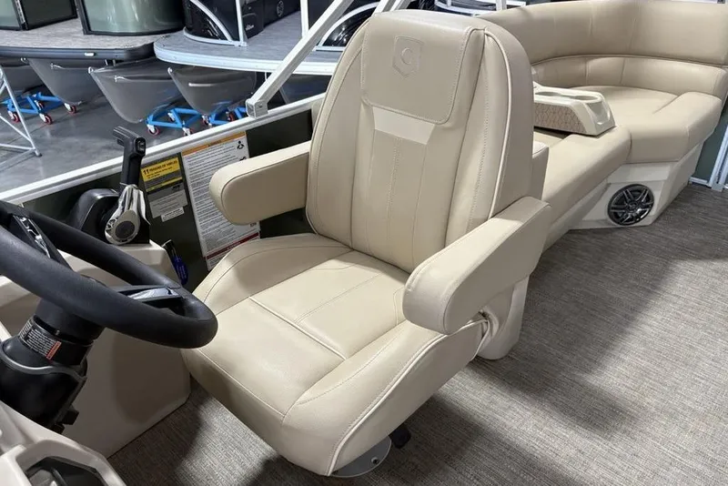 Slide: The Image of Captain's chair in 2025 Godfrey Xperience 2086 SBX pontoon boat, featuring beige upholstery. - 20
