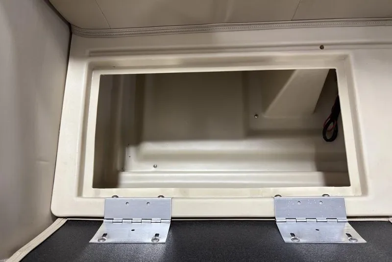 Slide: The Image of Open storage compartment in 2025 Godfrey Xperience 2086 SBX boat. - 25