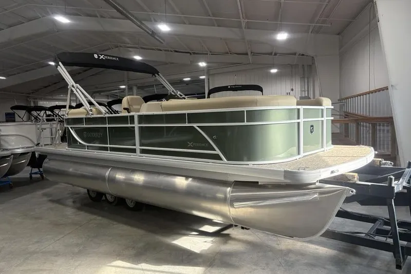 Slide: The Image of 2025 Godfrey Xperience 2086 SBX pontoon boat in a showroom, side view. - 4
