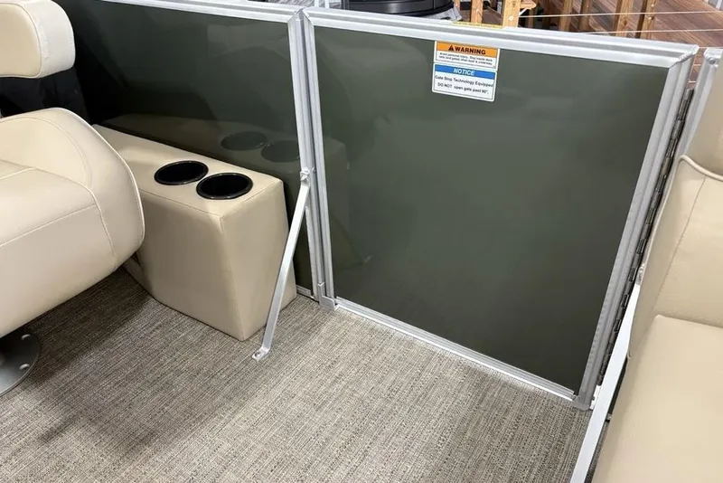 Slide: The Image of Interior of 2025 Godfrey Xperience 2086 SBX with beige seating and cup holders. - 7