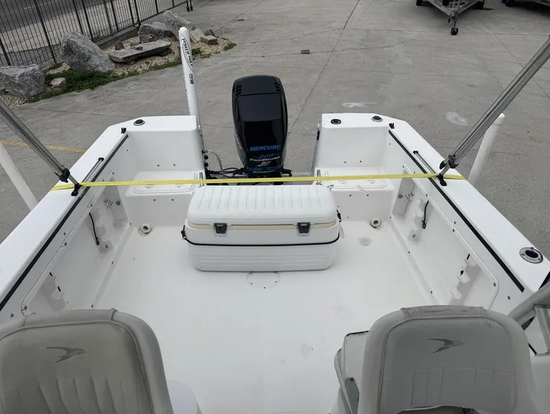Slide: The Image of 2004 Pro-Line 22 Walk boat interior with Mercury engine and seating. - 7