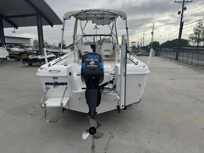 Slide: The Image of 2004 Pro-Line 22 Walk boat with 200 TwoStroke SaltWater engine, parked outdoors. - 8