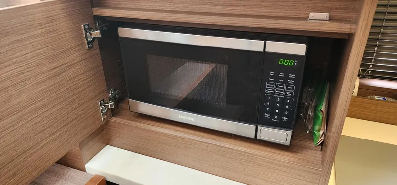 Slide: The Image of Microwave in Jeanneau Leader 12.5 WA 2022 boat's wooden cabinet. - 22