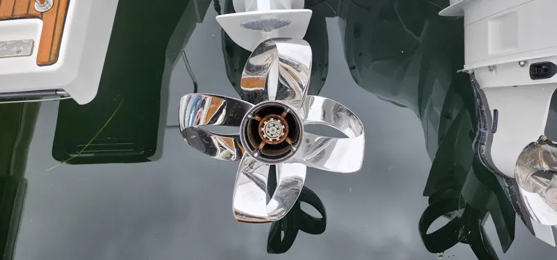 Slide: The Image of Shiny propeller of 2022 Jeanneau Leader 12.5 WA boat reflecting on water. - 38