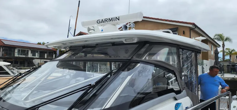 Slide: The Image of 2022 Jeanneau Leader 12.5 WA boat with Garmin equipment docked at marina. - 9
