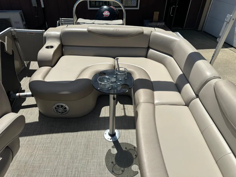 Slide: The Image of 2018 Avalon Catalina Cruise boat interior with beige seating and glass table. - 12