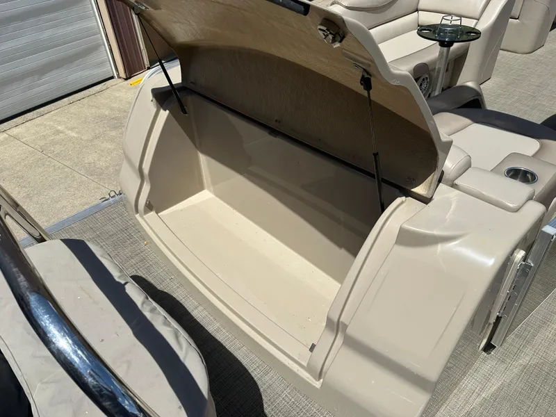 Slide: The Image of Open storage compartment on 2018 Avalon Catalina Cruise 25' boat, showcasing spacious interior. - 16