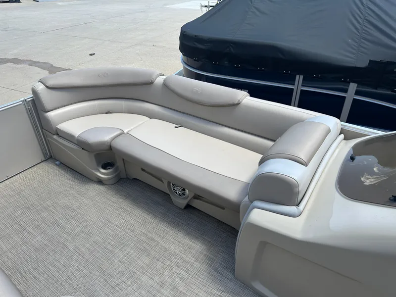 Slide: The Image of 2018 Avalon Catalina Cruise 25' boat interior with beige seating and carpeted floor. - 6