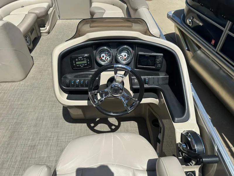 Slide: The Image of 2018 Avalon Catalina Cruise 25' boat dashboard with steering wheel and gauges. - 9