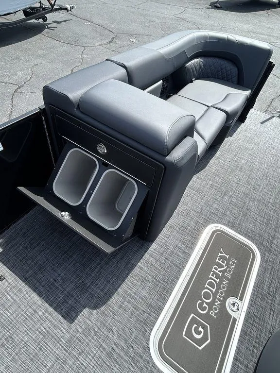 Slide: The Image of 2025 Godfrey Sweetwater 2286 SFLC pontoon boat interior with seating and storage compartments. - 16