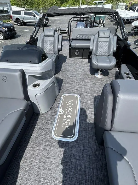 Slide: The Image of 2025 Godfrey Sweetwater 2286 SFLC pontoon boat interior with gray seating and modern design. - 7