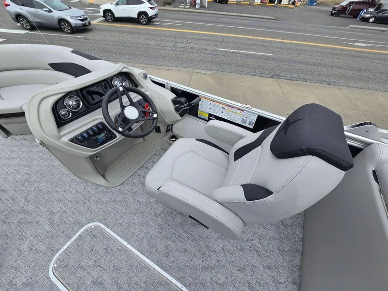 Slide: The Image of Interior of 2025 Berkshire 22 RFX LE pontoon boat with modern helm and seating. - 10