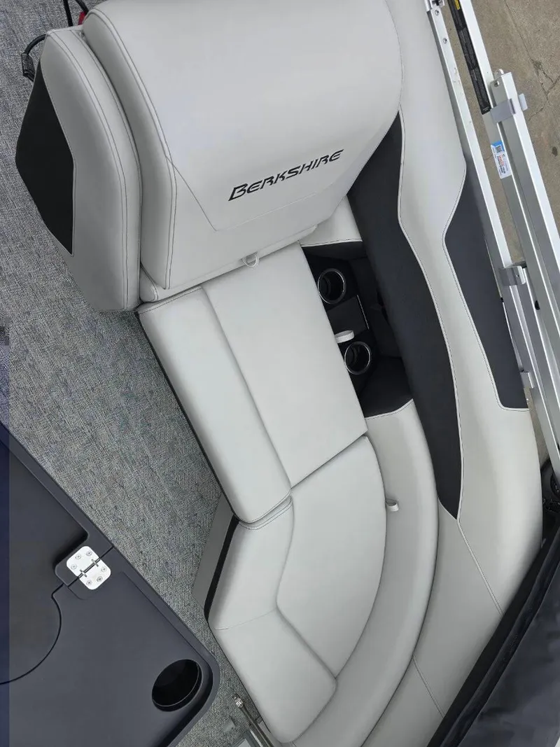 Slide: The Image of 2025 Berkshire 22 RFX LE boat interior with gray seating and cup holders. - 12