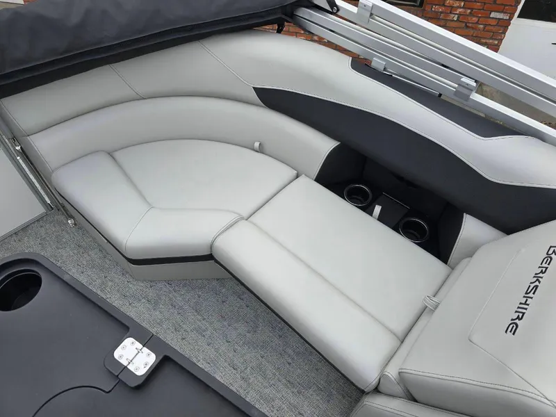 Slide: The Image of Luxurious seating on 2025 Berkshire 22 RFX LE pontoon boat with cup holders and sleek design. - 14
