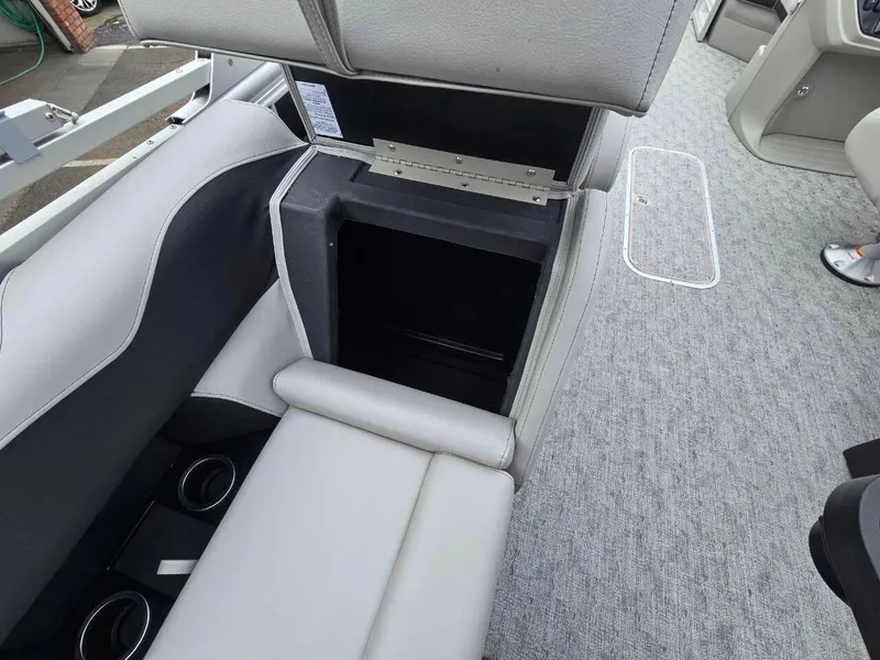 Slide: The Image of Interior of 2025 Berkshire 22 RFX LE boat showing storage compartment and seating. - 17