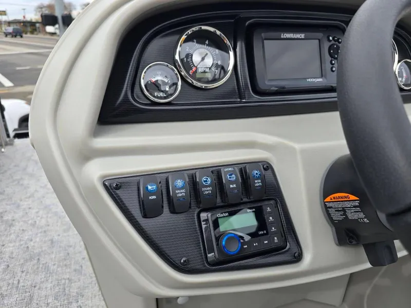 Slide: The Image of Dashboard of 2025 Berkshire 22 RFX LE boat with gauges and controls. - 21