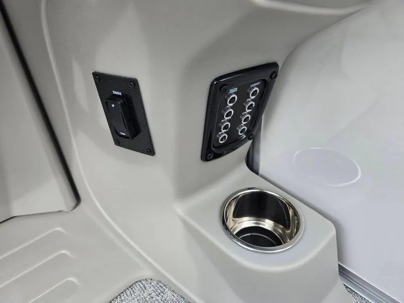Slide: The Image of 2025 Berkshire 22 RFX LE boat interior with control panel and cup holder. - 24